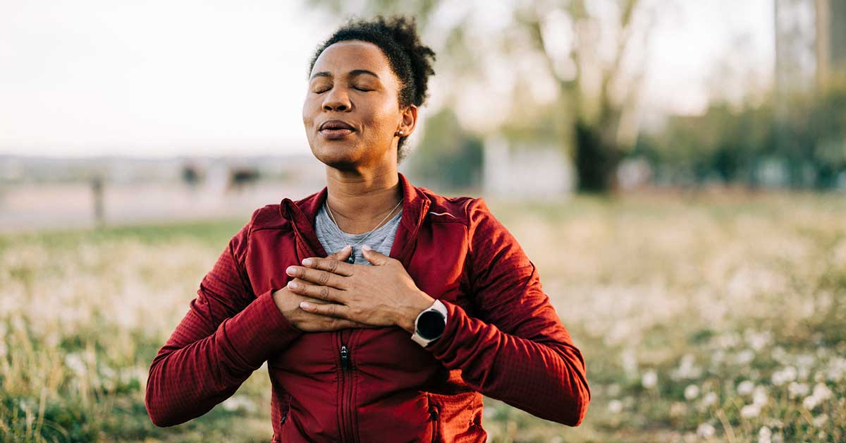 woman meditating outside