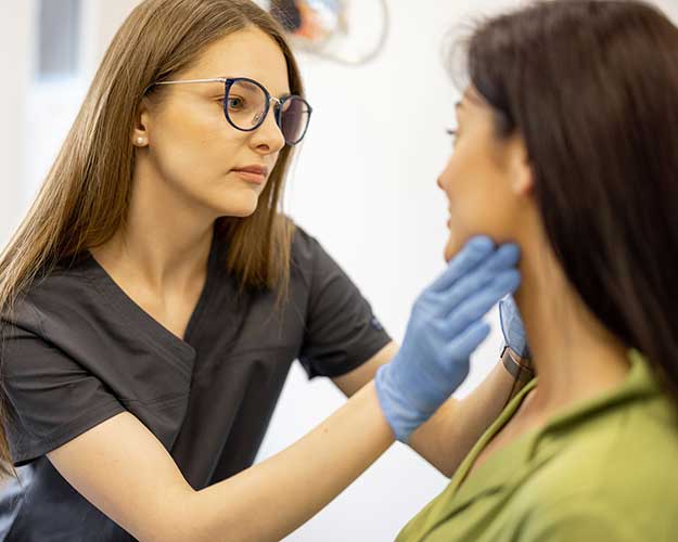 Dermatologist checkup on face