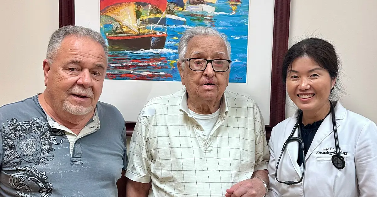 Basal cell carcinoma patient Joseph K., 99, with family and hematologist-oncologist Dr. Faye Yin celebrating successful targeted therapy treatment